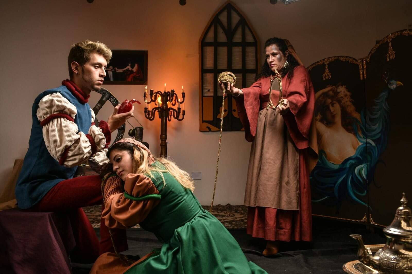 A captivating medieval-themed performance featuring three actors in period costumes.